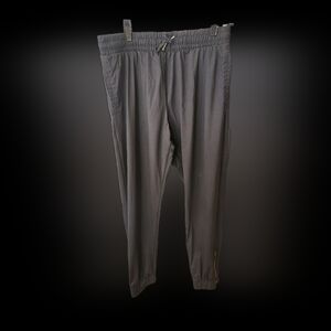 Zyia black jogger pants with zip down ankles in gold hardware